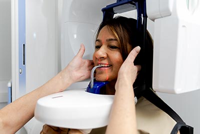 cosmetic dentistry patient receiving a full-mouth x-ray