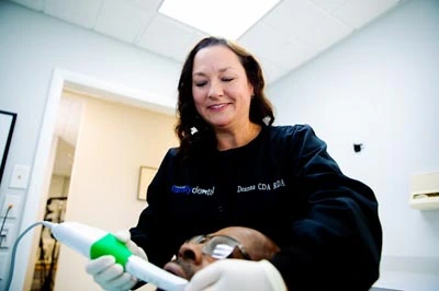 patient receiving a dental exam at Clementon Dental